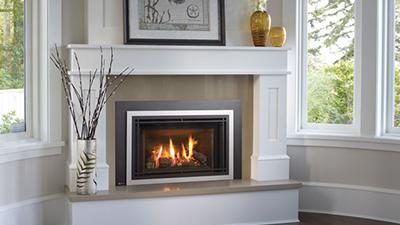 Gas Insert set with gray and white surround with a white wood mantle