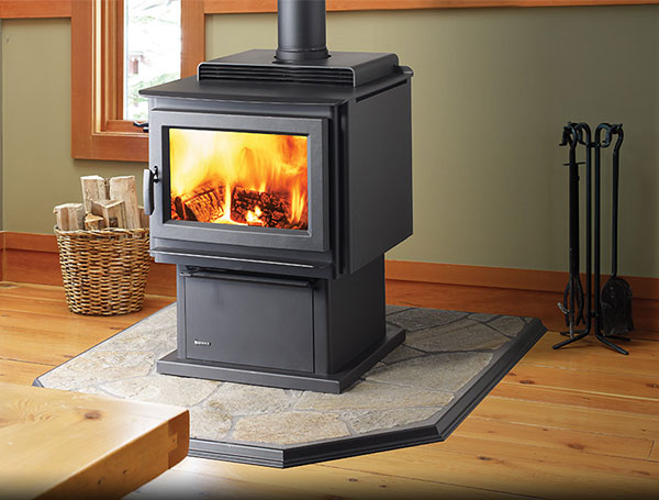 Regency F3500 Wood Stove - black, freestanding wood stove set atop stone hearth