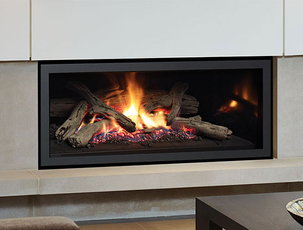 Regency U900E Gas Fireplace - - sleek, modern, black insert set in beige stone wall